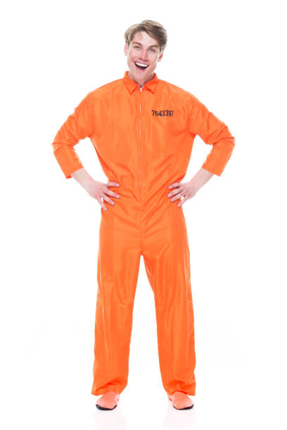 istock Male prisoner wearing orange jumpsuit 1149443399
