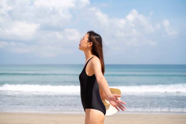 istock Young woman on a seaside beach holiday 1149443749