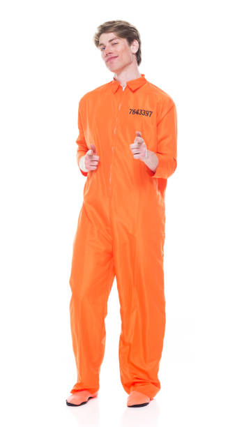istock Male prisoner wearing orange jumpsuit 1149443808