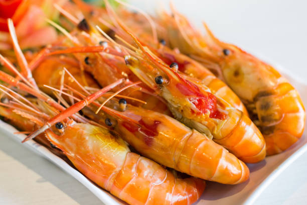 istock Grilled shrimp,Burn shrimp in white plate on the stone table. 1149443811