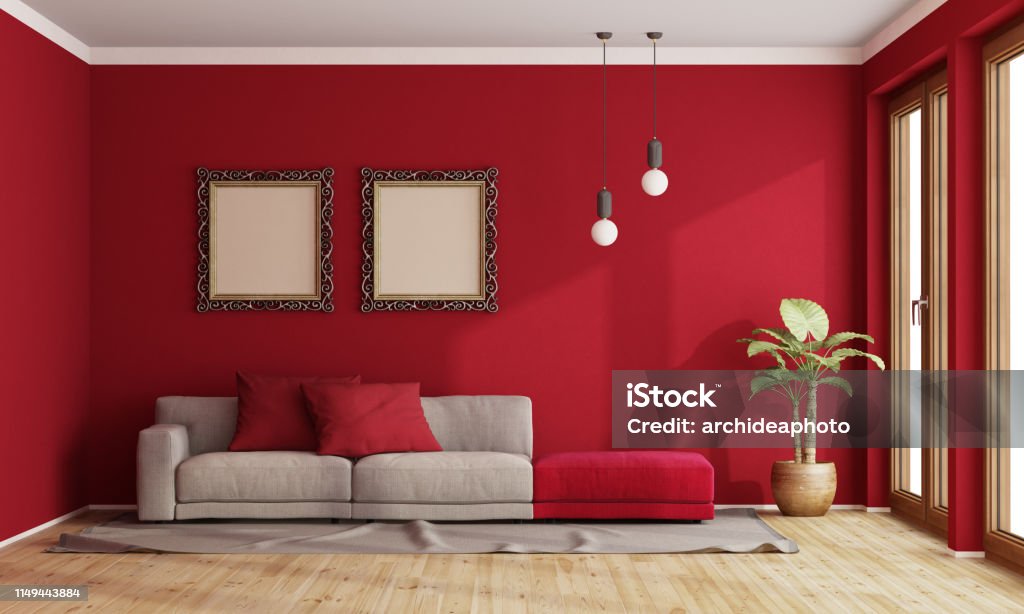 Red living room with modern sofa Red living room with modern sofa and old frame on wall - 3d rendering
the room does not exist in reality, Property model is not necessary Red Stock Photo