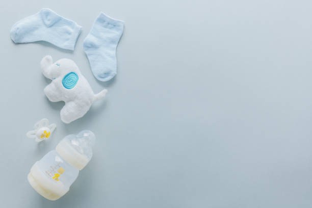 istock Baby goods on light pastel background 1149451514