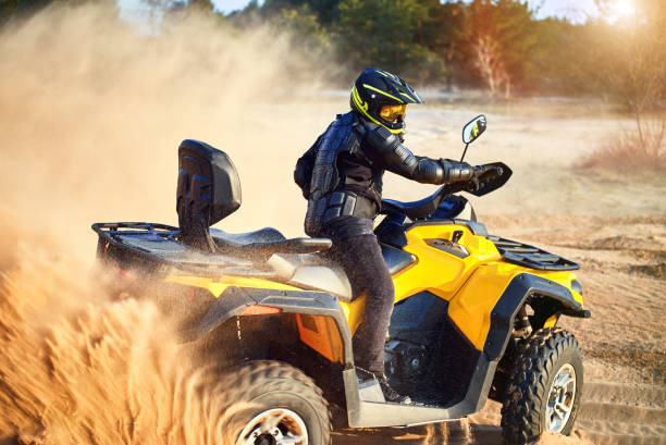 istock Racing powerful quad bike on the difficult sand in the summer. 1149453549
