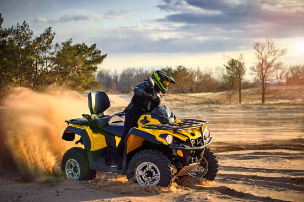 istock Racing powerful quad bike on the difficult sand in the summer. 1149453571