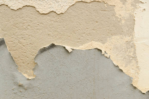istock Cracked concrete wall with old layers of paint. Copy space 1149454925