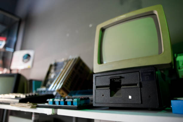 istock Close-up of ancient old and obsolete personal computer home use on old table wood. Obsolete technology concept. 1149457332