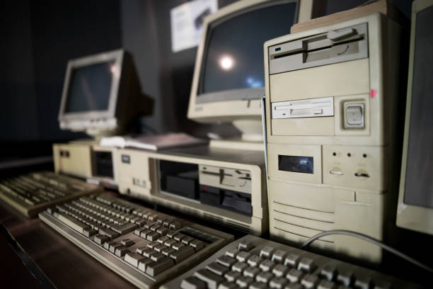 istock Close-up of ancient old and obsolete personal computer home use on old table wood. Obsolete technology concept. 1149457396
