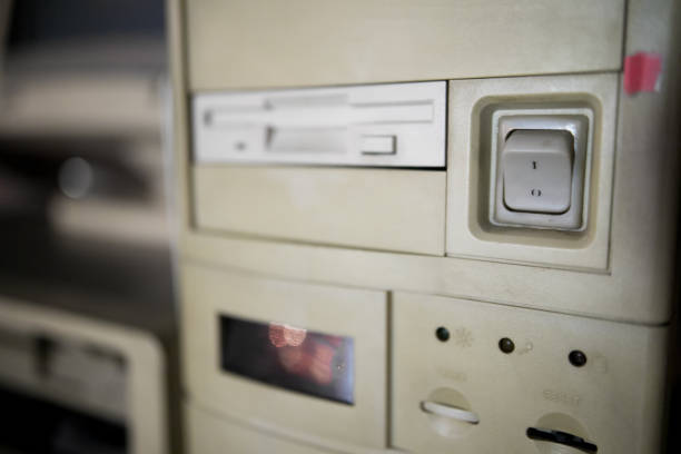 istock Close-up of ancient old and obsolete personal computer home use on old table wood. Obsolete technology concept. 1149457418