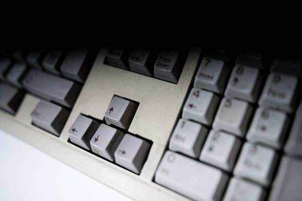 istock A close view of some keys on a dirty, yellowed keyboard. close up enter button 1149457789