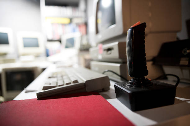 istock Close up on a joystick with a blurred background in an arcade hall 1149457844