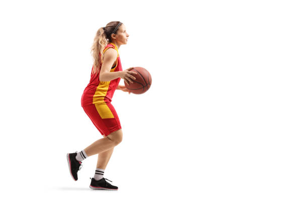 istock Female basketball player running with a ball 1149457901