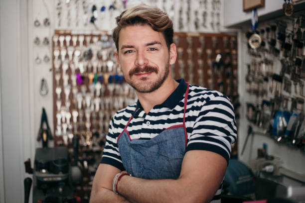 istock Handsome young locksmith posing in his family shop 1149458629