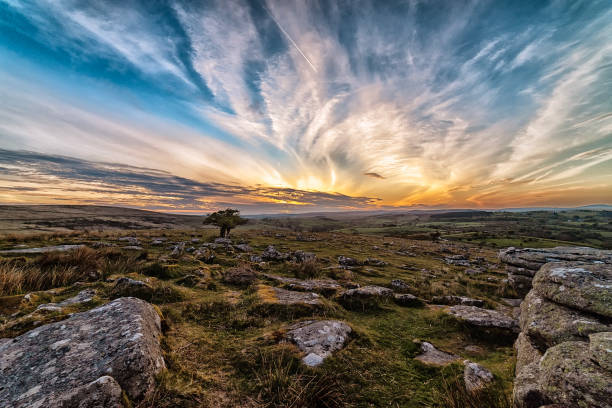 Sunset over the Dart Valley Sunset Mid May from Combestone Tor overlooking the Dart River Valley wilderness stock pictures, royalty-free photos & images