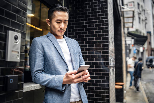 istock Asian businessman using his smartphone 1149461184