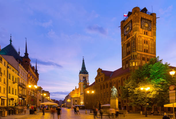istock Torun Town Hall and statue of Copernicus in evening 1149462520