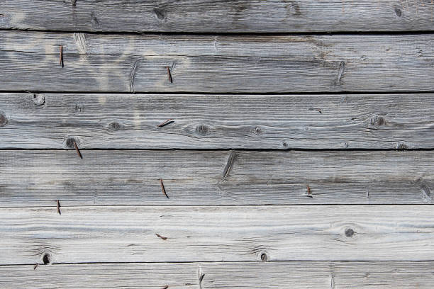 istock Old plank wooden wall background with nails 1149463723