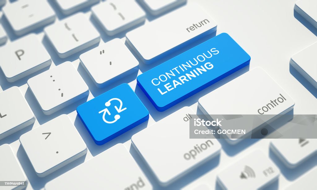 CONTINUOUS LEARNING Button on Computer Keyboard Advice Stock Photo