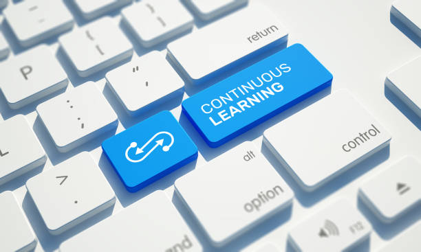 CONTINUOUS LEARNING Button on Computer Keyboard stock photo