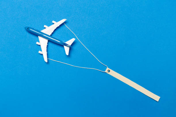 istock model of passenger plane on blue background 1149465422