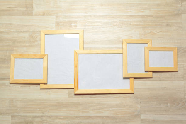 istock photo frames on the wooden wall 1149465862