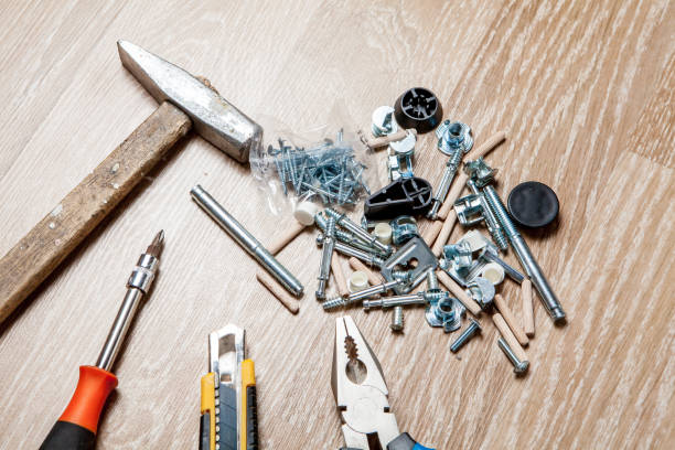 istock Cross head bolt screws thread with nails and hammer 1149467984