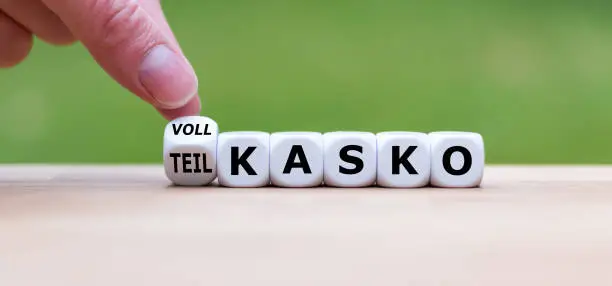 Photo of Hand turns a dice and changes the German word 