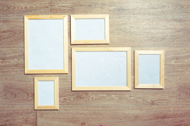istock photo frames on the wooden wall 1149468116