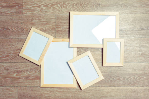 istock photo frames on the wooden wall 1149468493