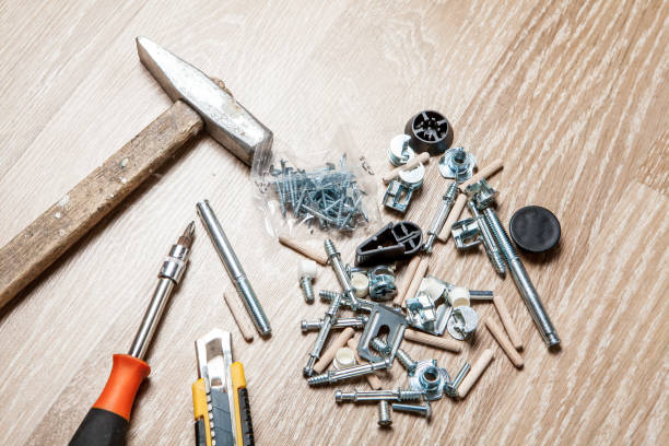 istock Cross head bolt screws thread with nails and hammer 1149468597