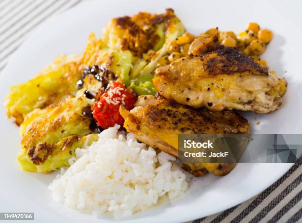 Chicken Thighs With Leaves Of Cabbage In Batter Garbanzo And Rice Stock Photo - Download Image Now