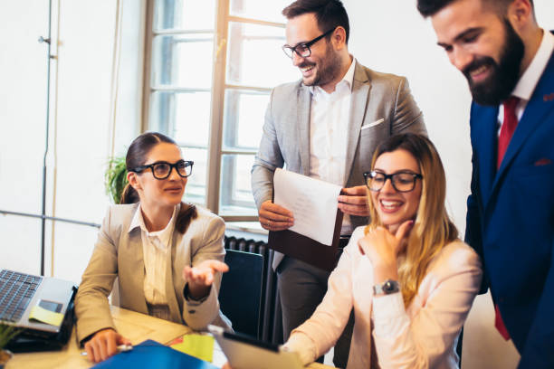istock Business people working in office together. Team work in office. 1149471837