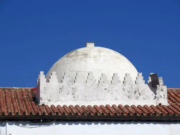 Whitewashed copula on old Tarifa building, Andalusia