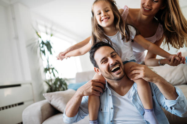 istock Happy family having fun time at home 1149473412