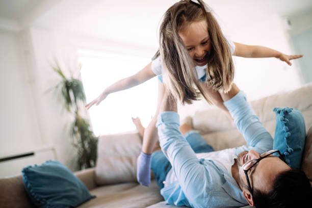 istock Happy family having fun time at home 1149473416