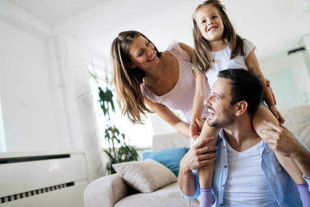 istock Happy family having fun time at home 1149473449
