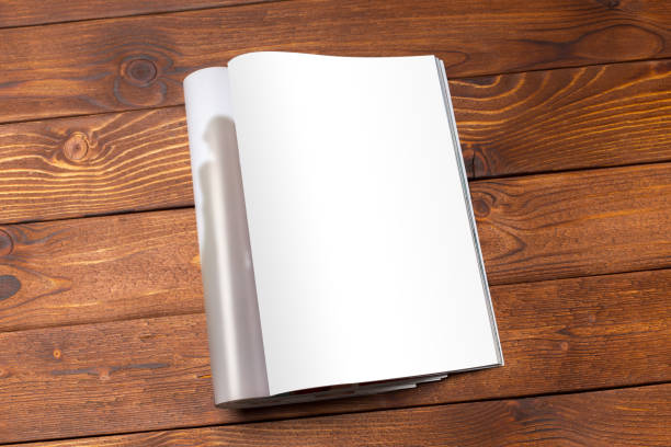 istock Blank book or magazine cover on wood background 1149475746