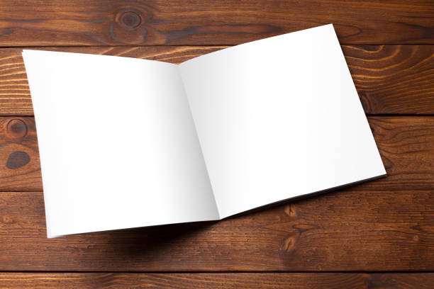 istock Blank book or magazine cover on wood background 1149477983