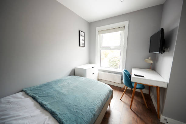 istock Bedroom in a modern house, looking towards window 1149478436
