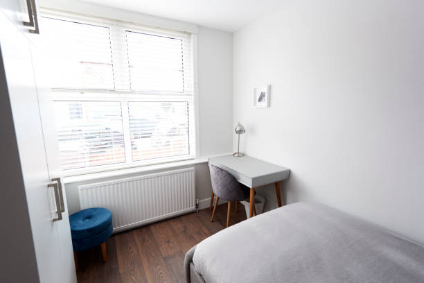 istock Modern bedroom with bed and desk by window 1149478816