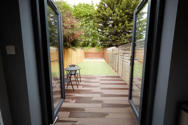 View to the garden from the back door of a refurbished house View to the garden from the back door of a refurbished house patio doors stock pictures, royalty-free photos & images