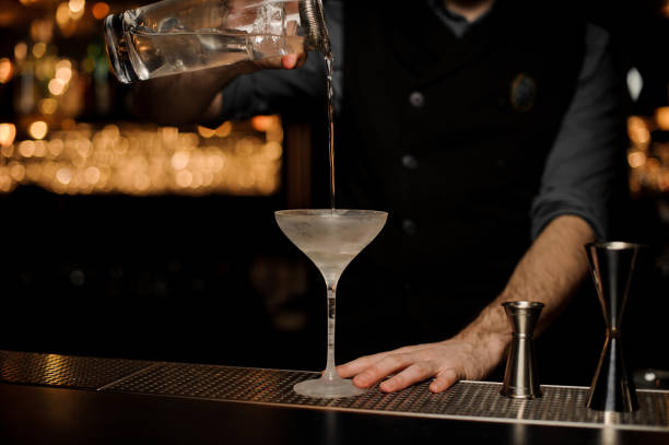 istock Bartender makes an alcohol cocktail with sieve on a jar 1149480421