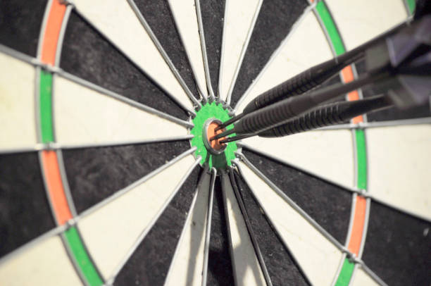 istock three darts hitting bulls eye on dartboard 1149481295