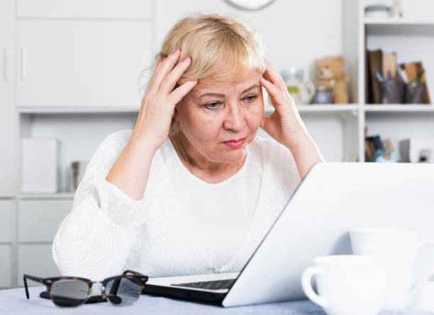 istock Mature woman with laptop 1149481455
