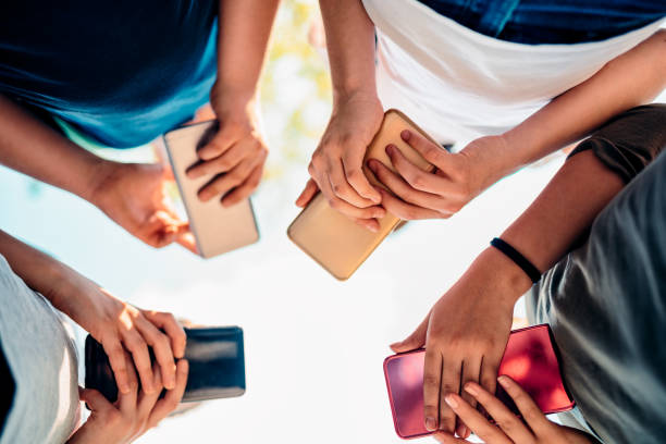 istock Kids playing video games on smart phone after school 1149483195