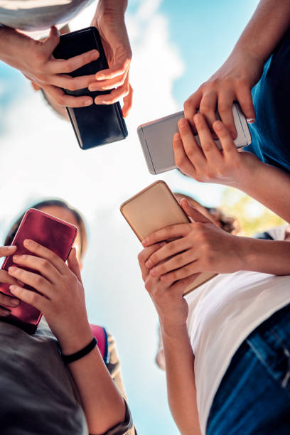 istock Kids playing video games on smart phone after school 1149488319