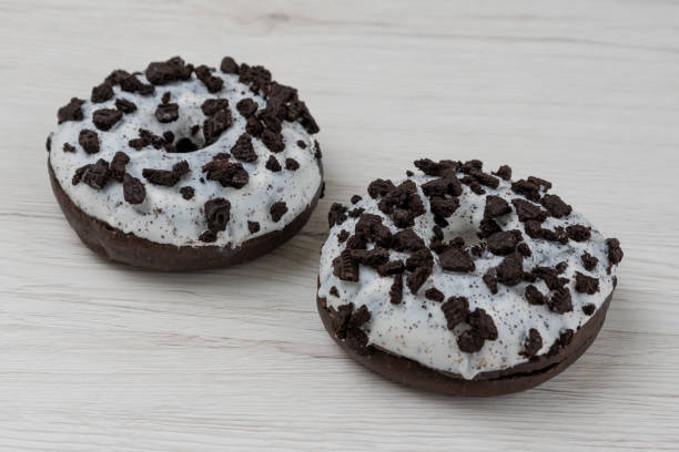 istock Donuts on a white wood background, close-up. 1149488398