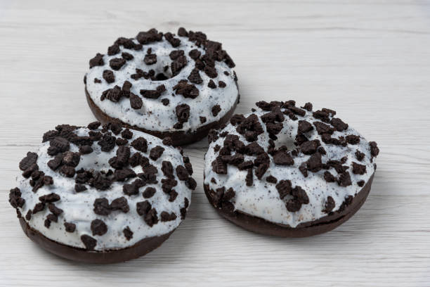 istock Donuts on a white wood background, close-up. 1149488400
