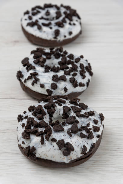 istock Donuts on a white wood background, close-up. 1149488416