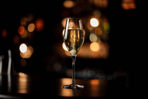 close-up of glass with a sparkling wine on bar counter - drink on top of ice food imagens e fotografias de stock