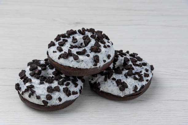istock Donuts on a white wood background, close-up. 1149488439